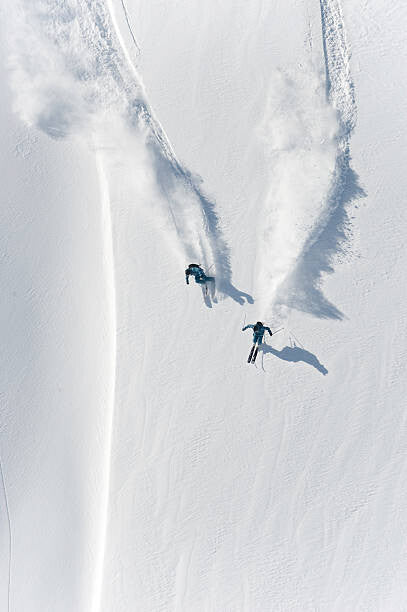 Leinwand Poster, Bilder Aerial view of two skiers skiing, Creativaimage, 60 × 90 cm