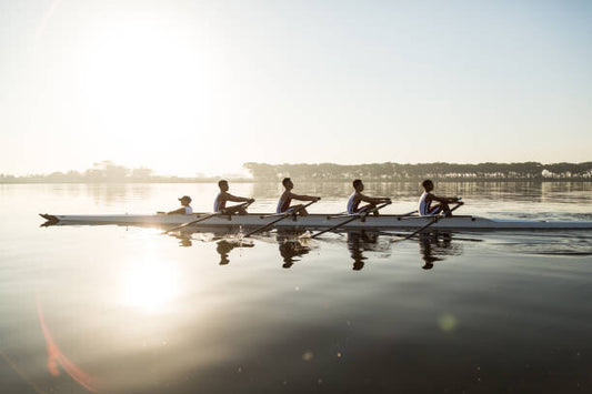 Leinwand Poster, Bilder Mixed race rowing team training on a lake at dawn, Alistair Berg, 90 × 60 cm