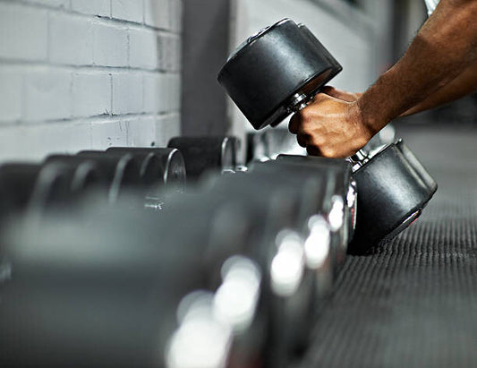 Leinwand Poster, Bilder Athletic Male Picking Up Dumbbells in Gym, Mike Harrington, 90 × 70 cm